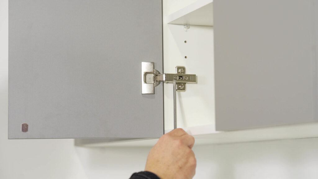 Image showing how to adjust hinges on your cabinets