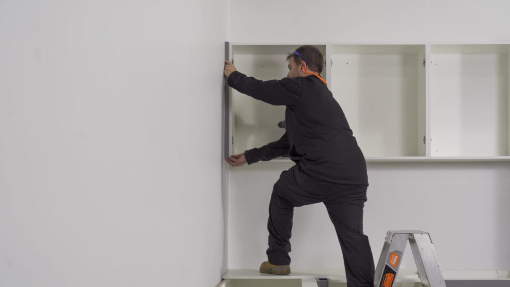 Image showing how to install a flush infill between the wall and cabinet