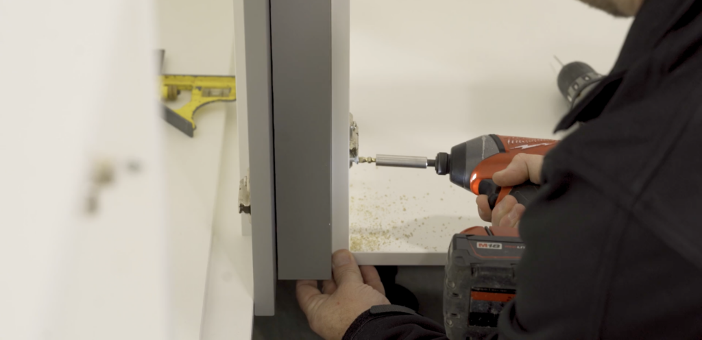 Image showing drilling into cabinets