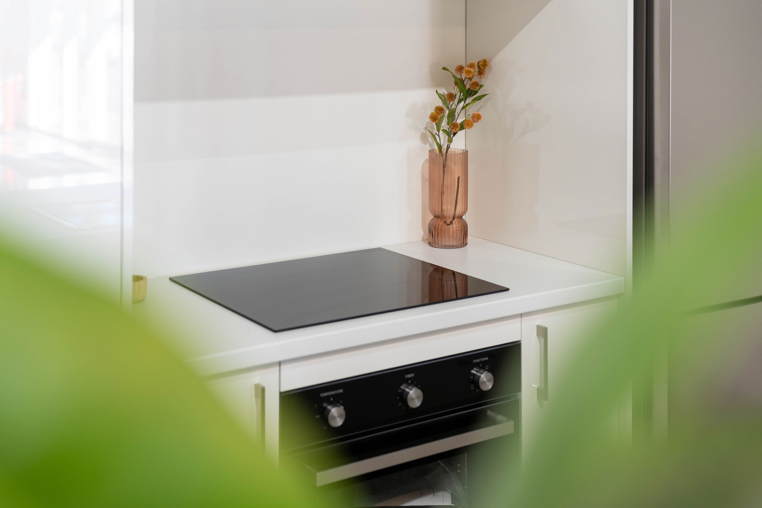 Image of Haier cooktop and Haier oven in white kitchen