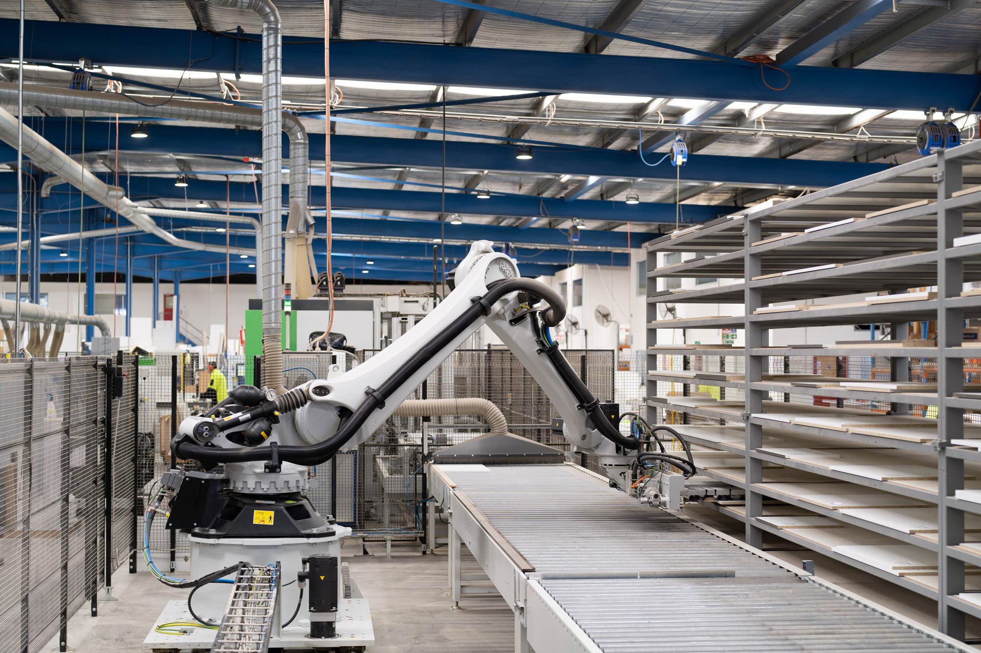 Image of our local state of the art cabinetry manufacturing facility, showing a robot