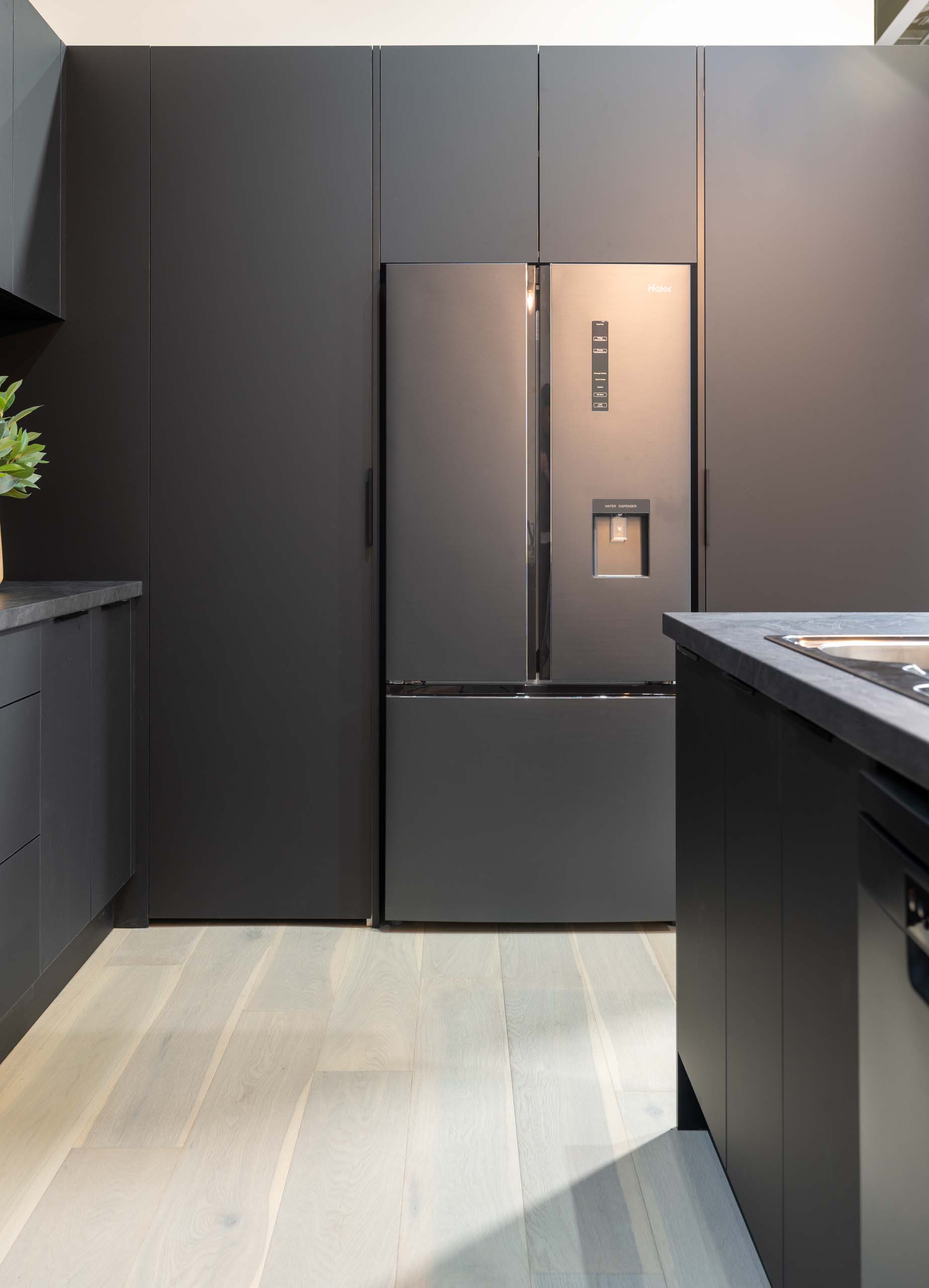 Black touch finish cabinetry with a black Haier French Door fridge
