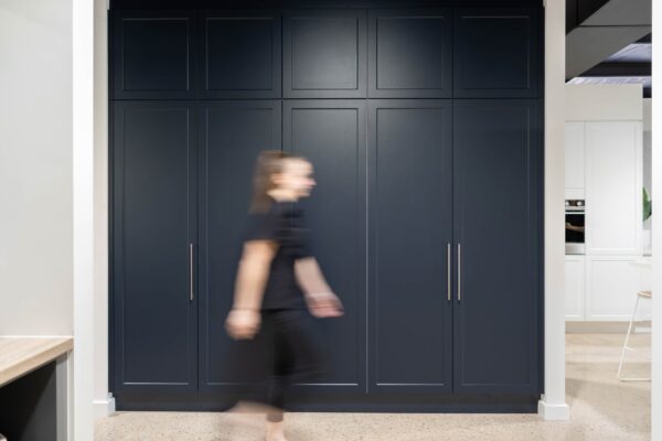 Indigo Blue cabinetry for hinged robes in a shaker style door.